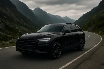 black-luxury-suv-on-mountain-road.